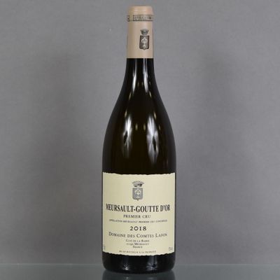 a bottle of wine that is sitting on a table