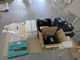 a table with boxes of electronics on it in a room