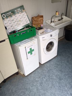 a washer and a dryer in a small room