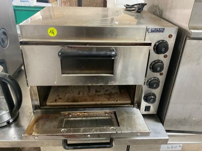 a small oven that is sitting on a counter