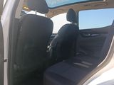 a white truck with the door open and the passenger seat down