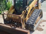 a picture of a bulldozer parked on the side of the road