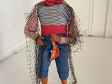 a figurine of a man with a fish in his hand