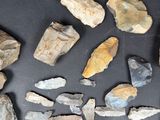 several pieces of rock are arranged on a black surface