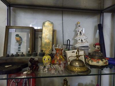 a glass display case with various items on it