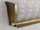 wall sconce in the shape of a vase on a wooden stand