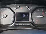 a close up of a car dashboard with a clock on it
