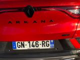 a close up of a red car with a license plate on it