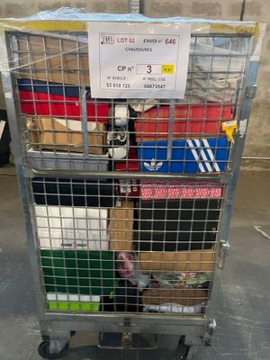 a metal cart with a lot of boxes on top of it