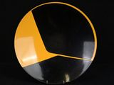an image of a black and yellow plate on a black background