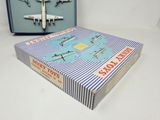 a box with a toy airplane in it next to a box of scissors