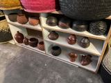 many baskets and baskets on display in a store