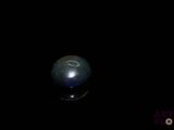 an image of a black ball in the dark