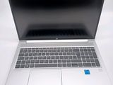an open laptop computer sitting on top of a white table