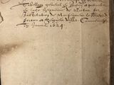 an old book with writing on it sitting on top of a table