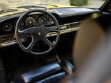 a steering wheel and dashboard of a car in a room