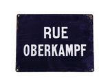 an old blue sign with the words rue obekrampf written on it