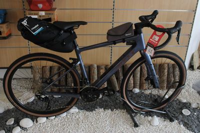 a bike that is parked in front of a wall
