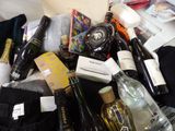 many bottles of wine and bottles of wine on the bed