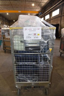 a cart with a lot of luggage in it in a warehouse