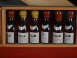 many bottles of wine in a wooden box