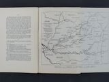 an open book with a map on it on a table