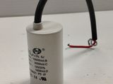 a close up of a capacitor on a table with a wire