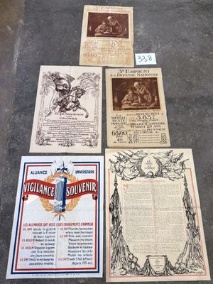 several old books are lined up on the floor next to each other