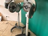 a hair dryer sitting on a stand in a room
