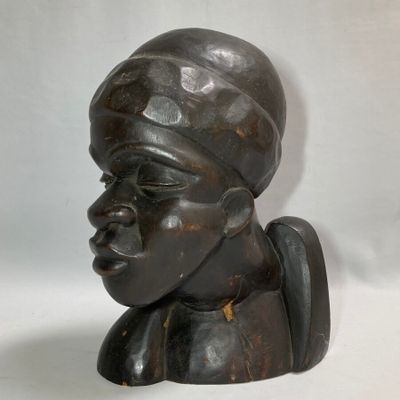 sculpture of a woman ' s head with a turban on it ' s head