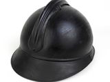 a black helmet that is sitting on a white surface