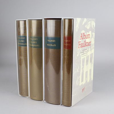 three books are stacked on top of each other on a table