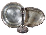 two silver trays and a silver plate on a stand