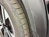 a close up of a tire on a car ' s rim