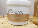 a picture of a jar of wella fusion hair mask next to a bottle of wella fusion hair mask