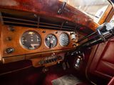 a dashboard of an old car with a clock on it