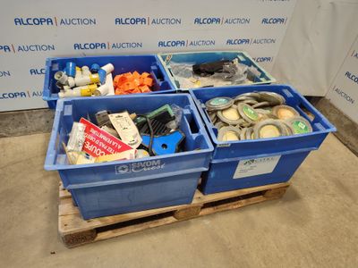 three blue bins filled with assorted items on a pallet