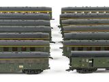 four train cars that are sitting next to each other