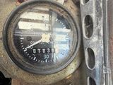 a close up of a speedometer on the side of the road