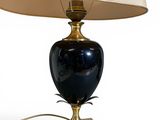 a lamp that is sitting on a table next to a lamp shade