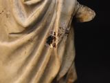 a statue of a woman with a veil on her head