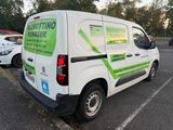 a white van that is parked in a parking lot