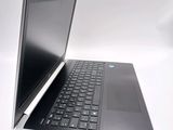 a laptop computer that is open on a white surface
