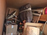 a pile of clutter in the corner of a room