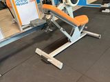 a gym room with a bench, weights, and other equipment