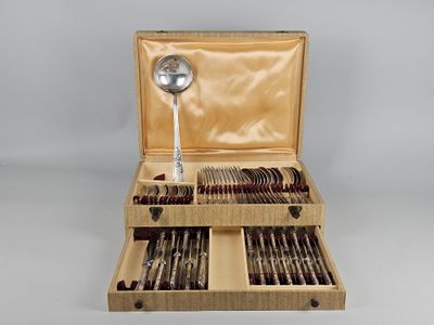 a wooden box with silverware and spoons in it