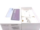 a white box with a pair of earphones in it