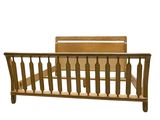 wooden bed frame with spindles and rails on a white background