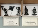 two boxes with black figurines of soldiers in them