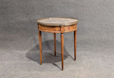 an image of a small round table with a marble top